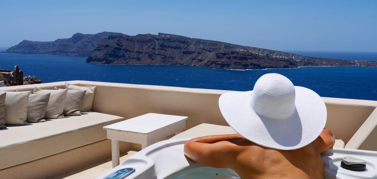 Woman in a bath at Oia, Santorini, Greece