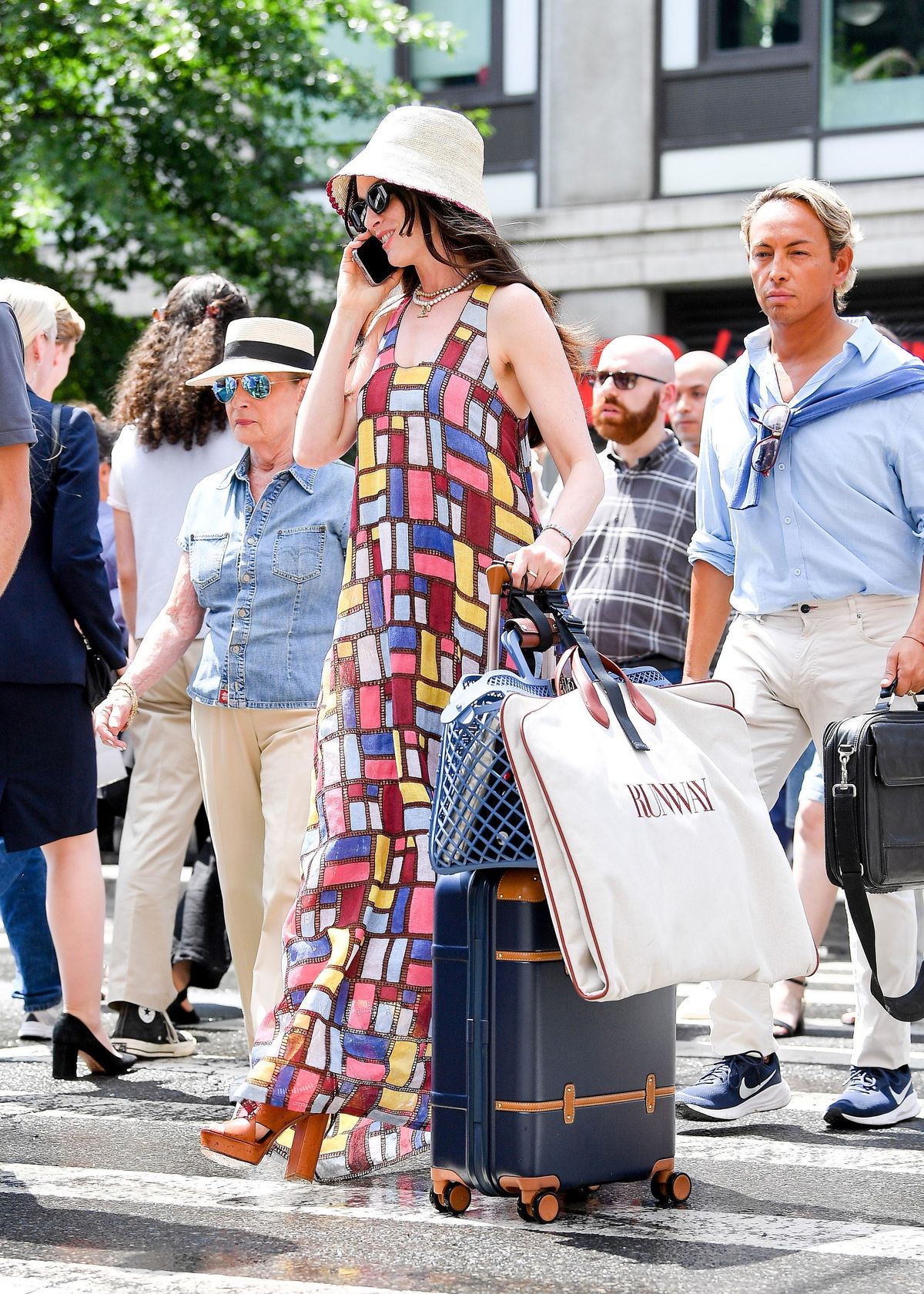 07/21/2025 Anne Hathaway is spotted on the set of Devil Wears Prada 2 in New York City. The American actress wore a bucket hat, colorful patterned dress, and brown platform sandals. 

sales@theimagedirect.com Please byline:TheImageDirect.com