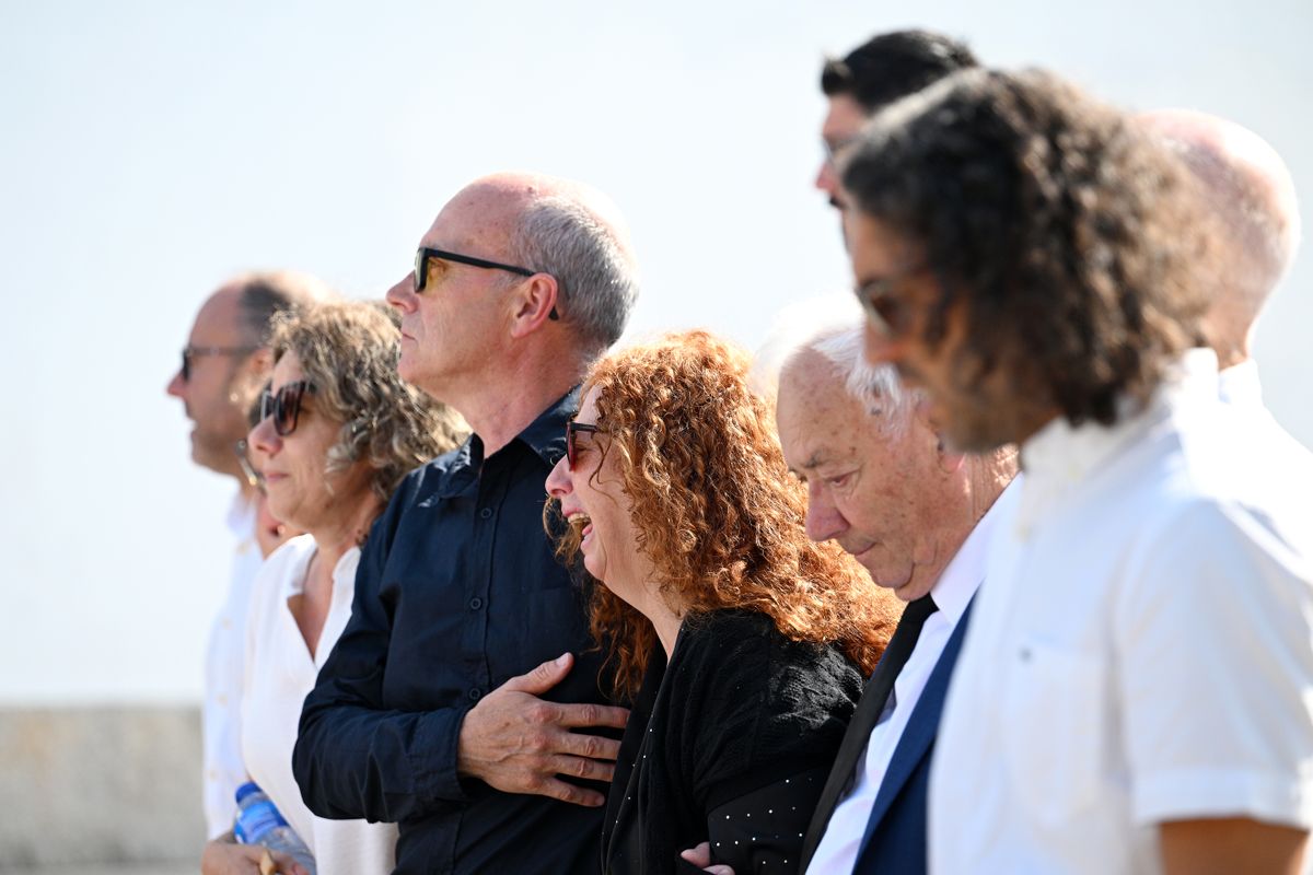 GONDOMAR, PORTUGAL - JULY 05: Joaquim Silva, Father of Diogo Jota And Andre Silva, consoles Isabel Silva, Mother Diogo Jota And Andre Silva, as they arrive in the procession at a funeral held for Diogo Jota and his brother Andre Silva at Igreja Matriz de Gondomar on July 05, 2025 in Gondomar, Portugal. Diogo Jota was a professional football player for Liverpool FC and the Portuguese national team, while Andre Silva played for FC Penafiel in Portugal's second tier. The brothers died in a car accident in the province of Zamora, Spain, on July 3. (Photo by Octavio Passos/Getty Images)