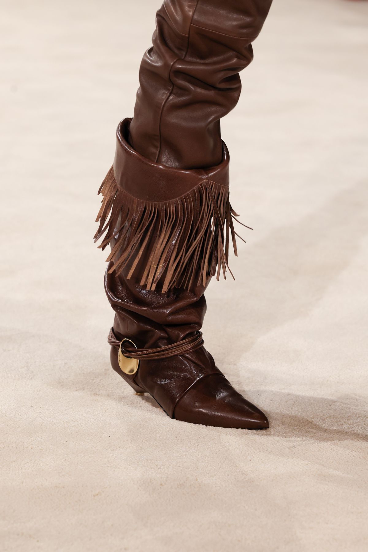 PARIS, FRANCE - FEBRUARY 29: (EDITORIAL USE ONLY - For Non-Editorial use please seek approval from Fashion House) A model, shoe detail, walks the runway during the Isabel Marant Womenswear Fall/Winter 2024-2025 show as part of Paris Fashion Week on February 29, 2024 in Paris, France. (Photo by Peter White/Getty Images)
