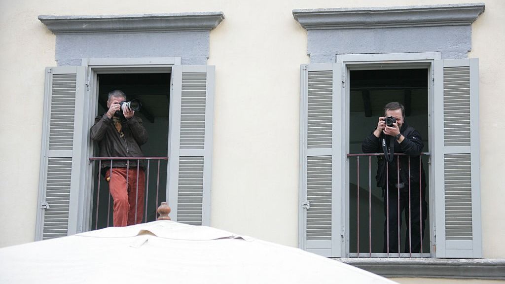 Paparazzis rent rooms with good viewing to shoot pictures of American actors Tom Cruise and Katie Holmes' wedding in Bracciano. (Photo by Stephane Cardinale/Corbis via Getty Images)