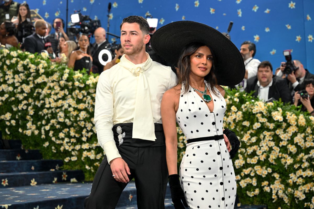 Indian actress Priyanka Chopra Jonas (R) and husband US singer-songwriter and actor Nick Jonas arrive for the 2025 Met Gala at the Metropolitan Museum of Art on May 5, 2025, in New York. The Gala raises money for the Metropolitan Museum of Art's Costume Institute. The 2025 Met Gala is themed "Tailored for You," aligning with the Costume Institutes exhibition, "Superfine: Tailoring Black Style," set to open to the public on May 10. (Photo by ANGELA WEISS / AFP)