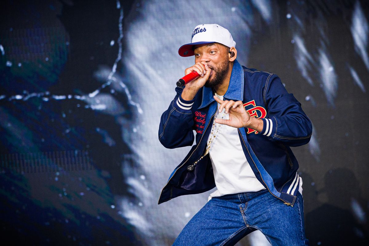 12 July 2025, Lower Saxony, Wolfsburg: US actor, film producer and rapper Will Smith takes to the stage during his concert at the Autostadt summer festival. Photo: Moritz Frankenberg/dpa (Photo by Moritz Frankenberg / dpa Picture-Alliance via AFP)