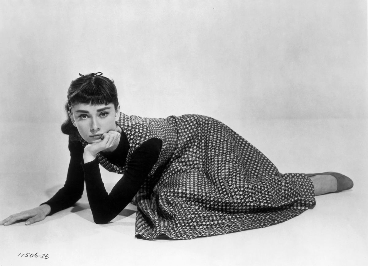 British actress Audrey Hepburn on the set of Sabrina, directed by Billy Wilder. (Photo by Sunset Boulevard/Corbis via Getty Images)
Audrey Hepburn,