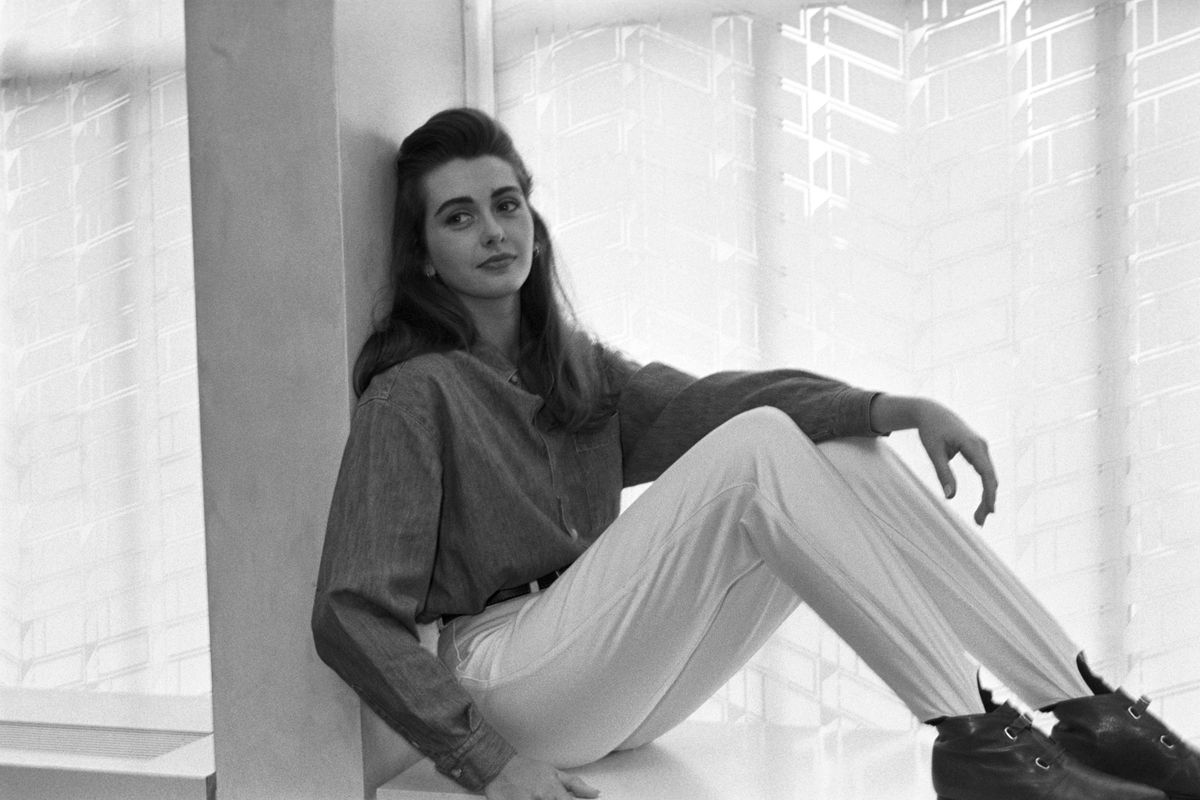 Woman modeling Guess? Jeans button-down shirt and stirrup pants. (Photo by Tony Palmieri/WWD/Penske Media via Getty Images)