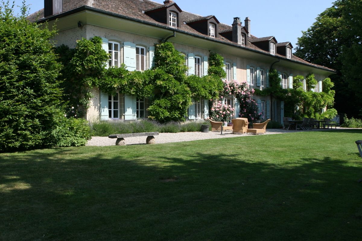The exterior of what was once home to Audrey Hepburn, VAUD, SWITZERLAND, A STUNNING 18th CENTURY VILLA owned by Audrey Hepburn could be yours as it hits the market.
The 12-bedroom home with a Grade 2 architectural classification, owned by the Hollywood icon for three-decades is located in the picturesque village of Tolochenaz, Lausanne, Vaud Switzerland and has been put up for sale for an undisclosed price. 
Images show the exquisite Swiss villa on this ultra-rare estate known as La Paisible meaning, the peaceful place. The main residence spans approximately 1,000 sq m across three levels and is served by two staircases and a lift. It was fully renovated in 2001.
There are terracotta floors, oak parquet, and five exquisite fireplaces. The expansive home boasts 21 rooms, including 12 generously proportioned bedrooms, a sumptuous principal suite, and eight bathrooms.
The property has five entrances, including one leading to a self-contained service apartment featuring two bedrooms and a fully equipped kitchen, seamlessly integrated into the main house.
The estate’s outdoor space includes the vast parkland, spanning over 16,000 sq m which is dotted with century-old trees, creating a tranquil retreat. There is also a heated swimming pool (15x5m) discreetly positioned away from the main house, offering ultimate privacy.
Two indoor garages and ample outdoor parking accommodate up to 15 vehicles.
The listing is held by Alex Koch de Gooreynd, Partner at Knight Frank.
"This outstanding residence is a rarity among exceptional properties," states the listing.
"This exceptional residence exudes a unique charm and is steeped in history.
“Switzerland remains a top choice for families mindful of taxation, with a steady flow of new enquiries exploring its diverse lifestyle offerings across the cantons. 
“While not the most affordable tax jurisdiction, Switzerland stands out for its exceptional stability, personal safety, and world-class education. Cantons that best align with families’ previous lifestyles are benefiting the most—particularly the Lake Geneva region and year-round resort destinations like Verbier, Gstaad, and Crans Montana, where access to private schools and vibrant communities is a key draw.
“Le Paisible, nestled in the tranquil village of Tolochenaz, offers an ideal balance of privacy and accessibility. Just a short drive from Lausanne—a dynamic alternative to Geneva with excellent schools—this charming country home provides a vast flat plot, exceptional seclusion, and ample space for a large family. 
“With property prices nearly 40% lower than Geneva and the airport just 35 minutes away, Lausanne is an increasingly attractive option for international buyers. 
“The home’s timeless architecture, a sought-after feature among Ultra-High-Net-Worth families, only adds to its appeal. It’s easy to see why Audrey Hepburn adored the environment, where she enjoyed both complete privacy and breathtaking surroundings.”
ENDS