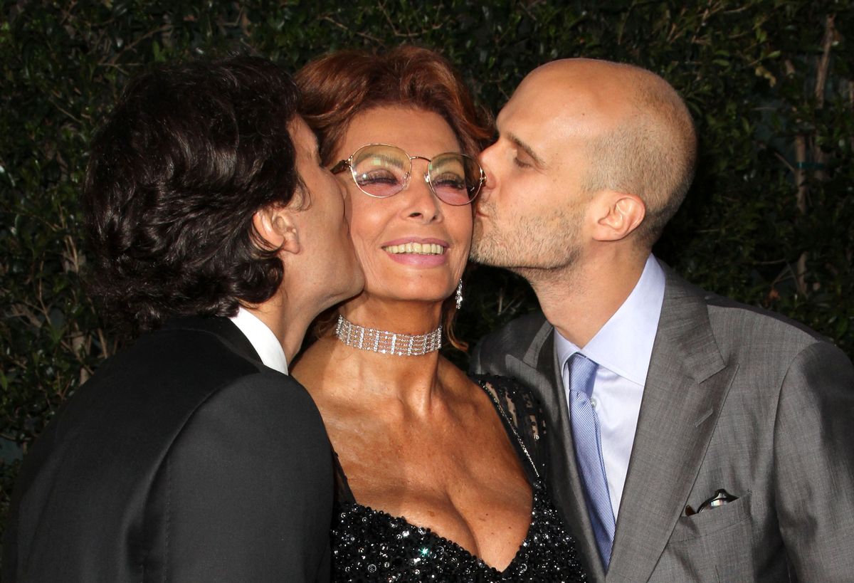 Actress Sophia Loren and her two sons composer Carlo Ponti Jr (L) and director Edoardo Ponti (R) arrive at the Academy of Motion Picture Arts and Sciences Tribute to Sophia Loren, in Beverly Hills, California, on May 4, 2011. AFP PHOTO/VALERIE MACON (Photo by Valerie MACON / AFP)