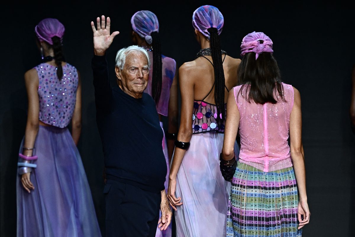 (FILES) Italian designer Giorgio Armani waves from the runway of the Emporio Armani fashion show during the Milan Fashion Week Womenswear Spring/Summer 2024 on September 21, 2023 in Milan. Italian fashion great Giorgio Armani has died at the age of 91 "surrounded by his loved ones", his company said on September 4, 2025. (Photo by GABRIEL BOUYS / AFP)