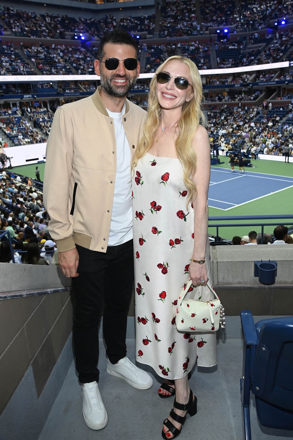 NEW YORK, NEW YORK - AUGUST 31: (L-R) Bader Shammas and Lindsay Lohan are seen inside the Cadillac Suite at the US Open at Arthur Ashe Stadium on August 31, 2025 in New York City. (Photo by Michael Simon/Getty Images for Cadillac)