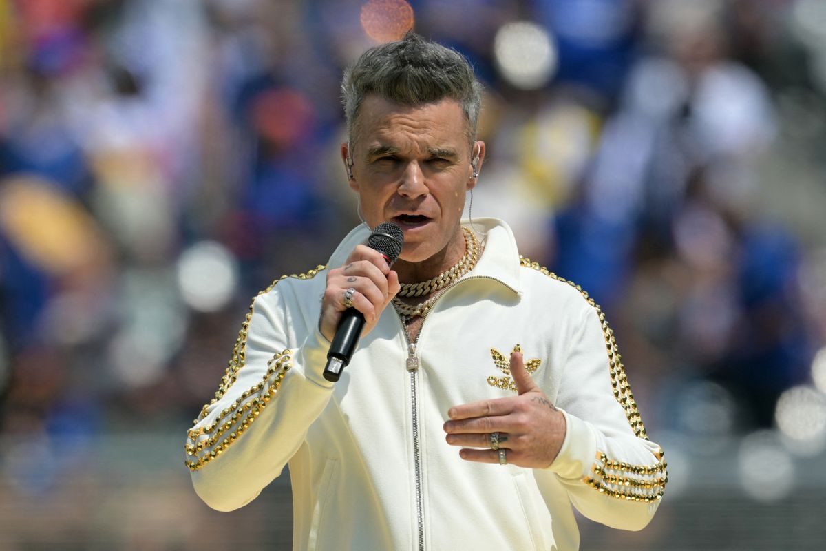 British singer Robbie Williams performs ahead of the FIFA Club World Cup 2025 final football match between England's Chelsea and France's Paris Saint-Germain at the MetLife Stadium in East Rutherford, New Jersey on July 13, 2025. (Photo by JUAN MABROMATA / AFP)