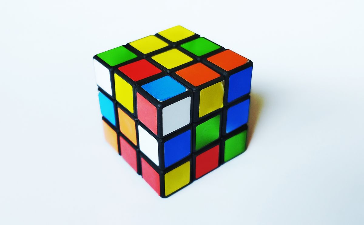 east java,indonesia, august 22,2023:Rubik's 3x3x3 Cube on a white background. The Rubik's Cube was invented by a Hungarian architect Ernő Rubik in 1974