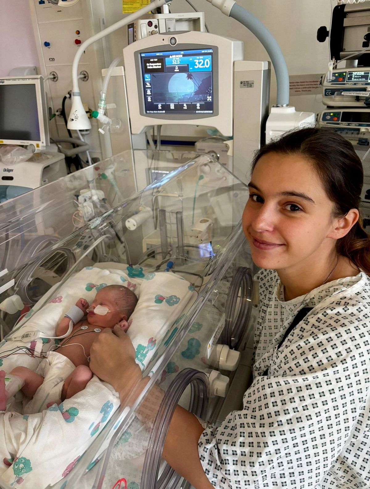 Megan Isherwood with baby Jackson in hospital. // A young woman rushed to hospital with suspected appendicitis ended up giving birth to a baby boy.  Megan Isherwood, 26, was rushed to hospital after suffering severe pains in her right side and vomiting up blood.  Doctors at Blackpool Hospital feared she had appendicitis and ordered ultrasound and CT scans.  To their surprise they saw a little head and foot and realised that she was pregnant - even though she had taken a test days earlier which was negative.  The bar manager was then blue-lighted to Burnley hospital but on the way she gave birth to little Jackson who weighed 4.6lbs on Sept 9. Megan, from Burnley, Lancs, said: "I was speechless - I couldn't believe what had just happened. 
Photo released 02/10/2025