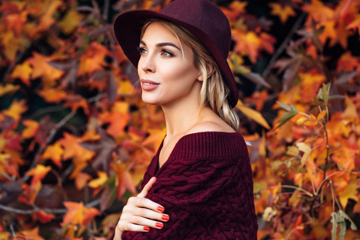 Beautiful woman enjoying in a sunny autumn day