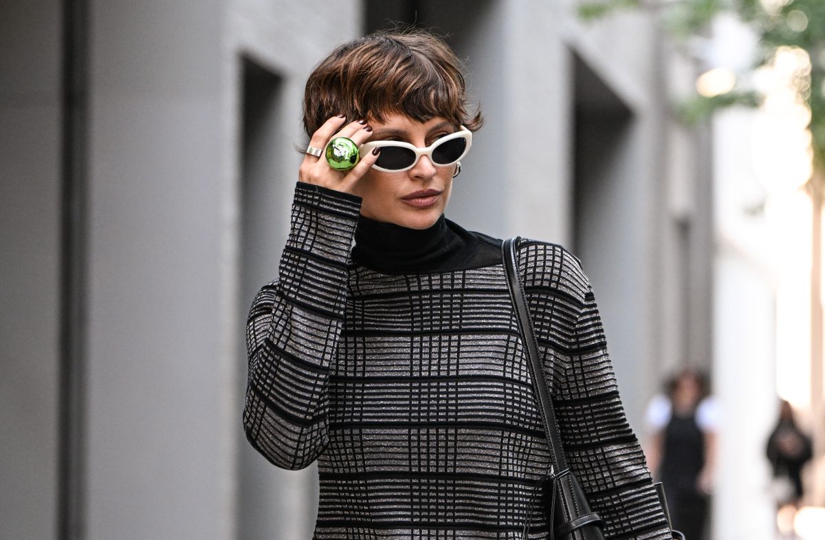 NEW YORK, NEW YORK - SEPTEMBER 11: Irina Kro Eicke is seen wearing a black and gray sweater and skirt, white sunglasses outside the Kate Barton show on September 11, 2025 in New York City. (Photo by Daniel Zuchnik/Getty Images)