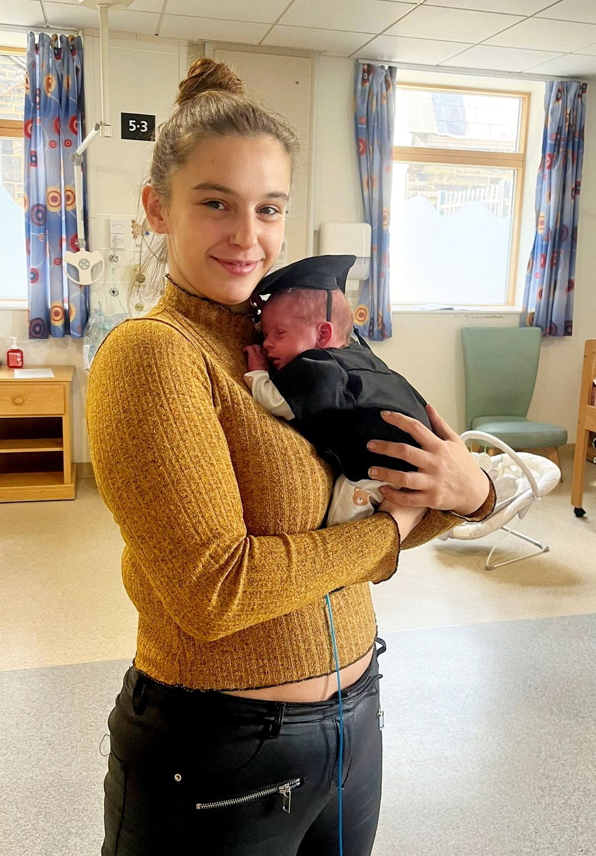 Megan Isherwood with baby Jackson in hospital.  // A young woman rushed to hospital with suspected appendicitis ended up giving birth to a baby boy.  Megan Isherwood, 26, was rushed to hospital after suffering severe pains in her right side and vomiting up blood.  Doctors at Blackpool Hospital feared she had appendicitis and ordered ultrasound and CT scans.  To their surprise they saw a little head and foot and realised that she was pregnant - even though she had taken a test days earlier which was negative.  The bar manager was then blue-lighted to Burnley hospital but on the way she gave birth to little Jackson who weighed 4.6lbs on Sept 9. Megan, from Burnley, Lancs, said: "I was speechless - I couldn't believe what had just happened. 
Photo released 02/10/2025