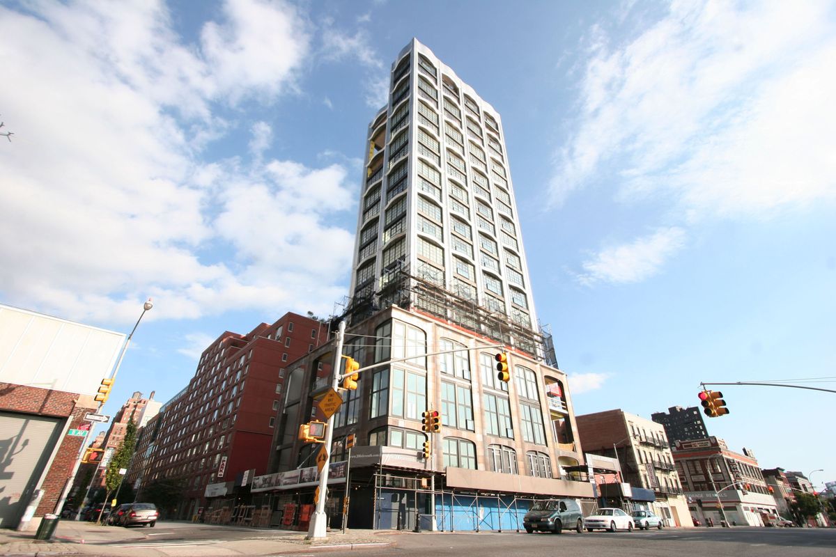 43570, NEW YORK, NEW YORK - August 13, 2010. Oscar winning actress Nicole Kidman and her Grammy award winning husband Keith Urban recently splashed out $10 million for a duplex in the critically acclaimed Annabelle Selldorf designed building at the edge of the heart of the Chelsea Arts District. Kidman and Urban bought a duplex unit that measures 3,248 square feet and includes 3 bedrooms, 3.5 baths, and two city view loggias. 
The main living spaces are located on the unit's upper floor and include a 20-foot by 22-foot living room with western views over the Hudson River towards New Jersey, and a combination dining room and a gourmet kitchen with folding oiled teak panels that when closed conceal the kitchen equipment. Just beyond the kitchen/dining room, a large study/bedroom with walk-in closet and private bath has Hudson River views to the west and opens to one of the two covered covered loggias that anchor the eastern corners of the duplex . A breezeway with built in storage closets and a powder room links the two loggias and opens into the kitchen as well as to the single car garage in the sky.
The lower floor is accessed by a dramatic staircase that descends from the living room down into a double height great room with two walls of floor to ceiling glass with double glass doors that slide open to glass balustrades that obliterate any visual barrier between the interior spaces and the glittering and enviable views. A guest bedroom with en-suite bath sits in the north east corner and the master bedroom includes a wall of closets, dressing area and large windowless bath with teak cabinetry and floors, double sinks sitting on a counter top of imported French glazedlavastone Pyrolave, acid etched mirrors, separate glass enclosed shower, and freestanding honed granite soaking tub.
Amenities in the sleek stainless steel and cast gunmetal glazed terra cotta clad tower include a 24/7 attended lobby, key-lock elevators, cold storage for food deliveries, a second floor fitness center with treatment room, Hudson River views, and terraces, and, custom private garages. 14 of the building's 16 apartments, come with a private 300 square foot "En-Suite Sky Garage™", accessed by driving one's luxury automobile into a giant key-lock elevator that lifts the car up to the same level as the the apartment to which it is deeded.
Other owners of residences in the state of the art state of the art building include fashion designer Domenico Dolce who recently paid $29.5 million for two duplex penthouse units, interior designer Jamie Drake and real estate agent extraordinaire Leonard Steinberg.,Image: 77773456, License: Rights-managed, Restrictions: , Model Release: no
