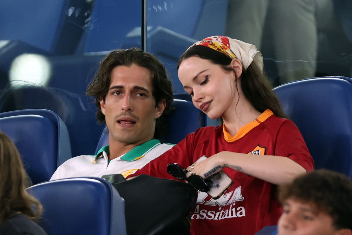 ROME, ITALY - 2025/08/23: Damiano David and his girlfriend Dove Cameron are seen in the celebrity stands as they attend the Serie A Enilive 202526 season opener between AS Roma and Bologna FC 1909 at the Stadio Olimpico. Final score Roma 1 : 0 Bologna. (Photo by Marco Iacobucci/SOPA Images/LightRocket via Getty Images)