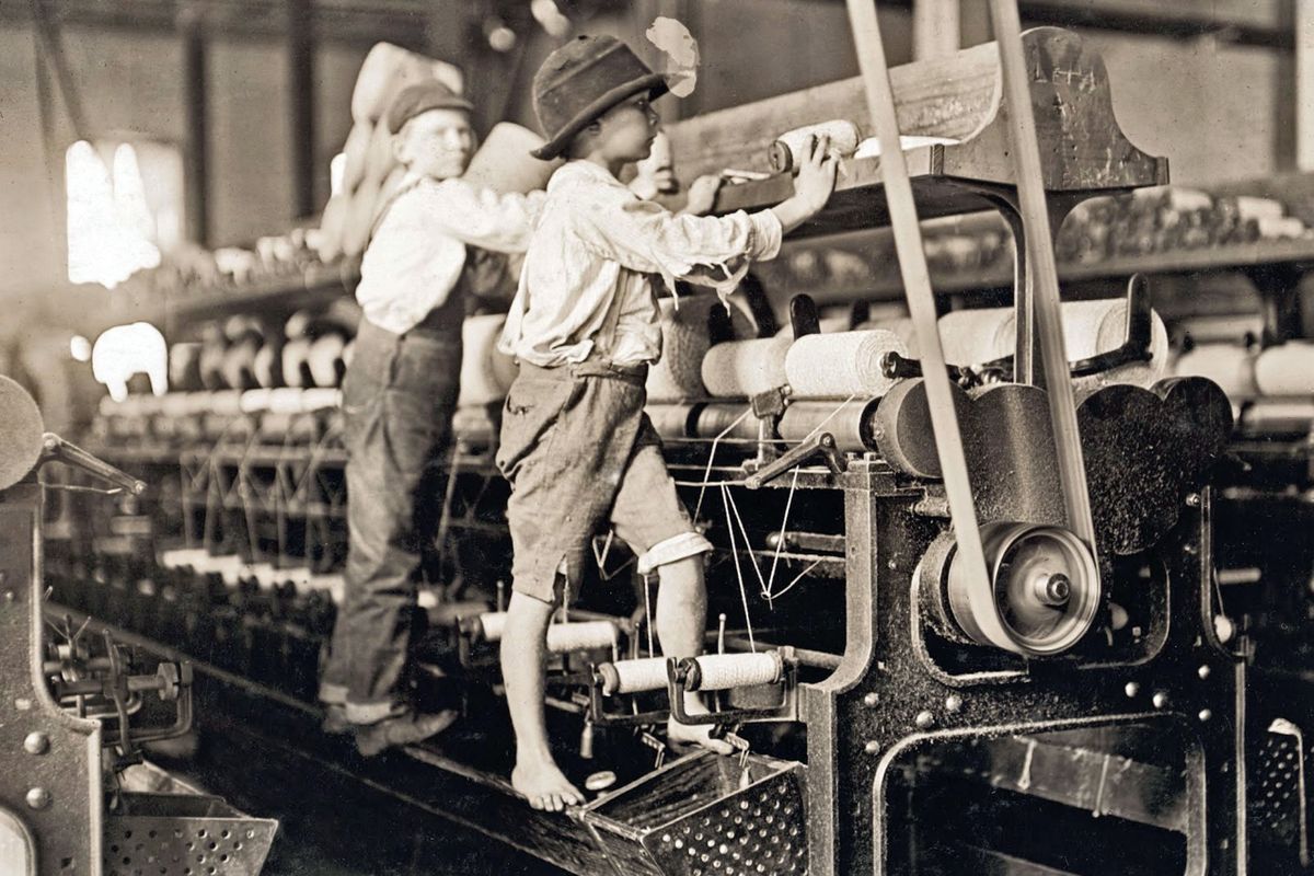 Photograph of child laborers in Cherryville Mfg. Co. Photographed by Lewis Hine. (Photo by: Universal History Archive/Universal Images Group via Getty Images)