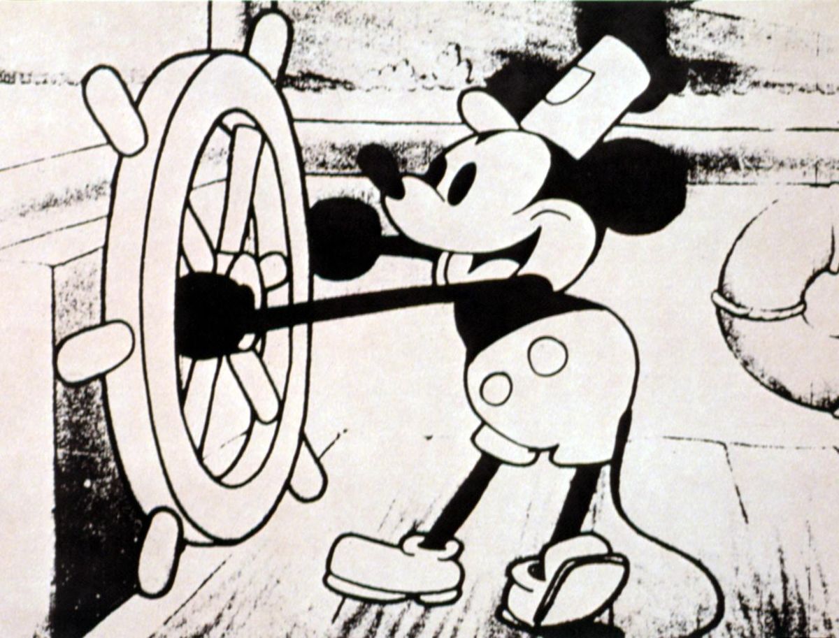 Mickey egér a Willie, a gőzhajóban. Épp kormányozza a hajót.