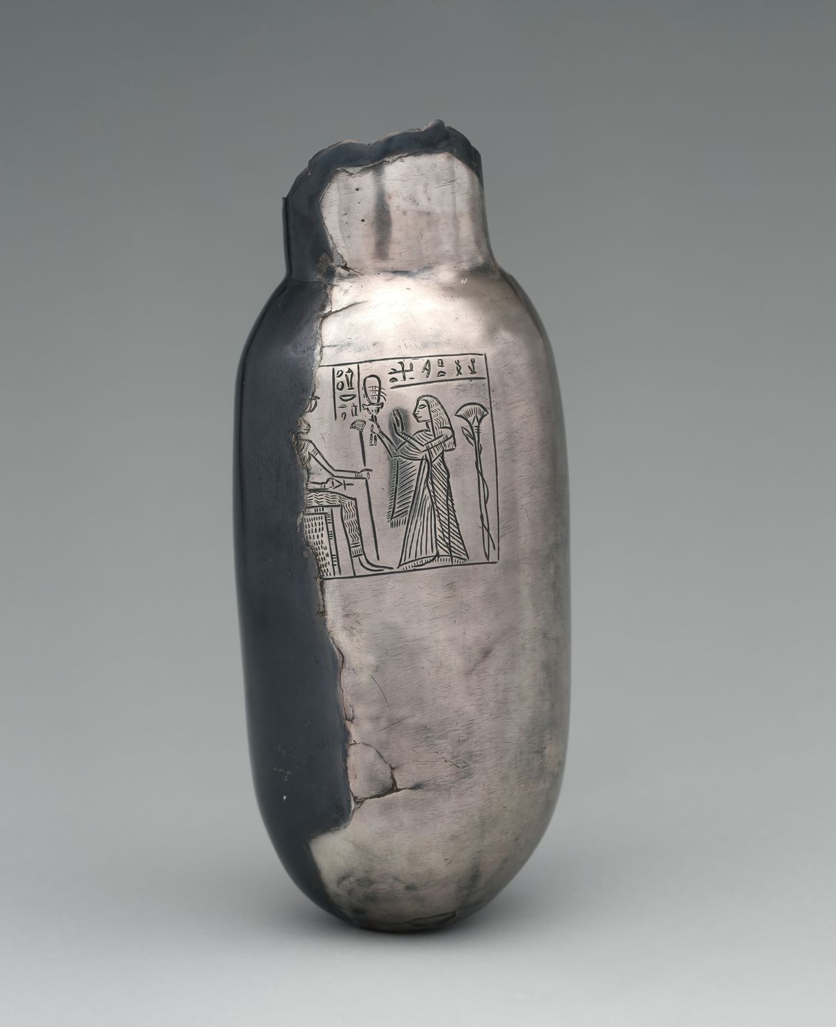 Silver bottle with offering scene naming Meritptah, New Kingdom, Ramesside, Dynasty 19, Ramesses II or slightly later, ca. 1279–1213 B.C., From Egypt, Eastern Delta, Tell Basta (Bubastis), Temple of Bastet, ancient cache, Silver, H. 16.2 cm (6 3/8 in.); Diam. 6.8 cm (2 11/16 in.). (Photo by: Sepia Times/Universal Images Group via Getty Images)