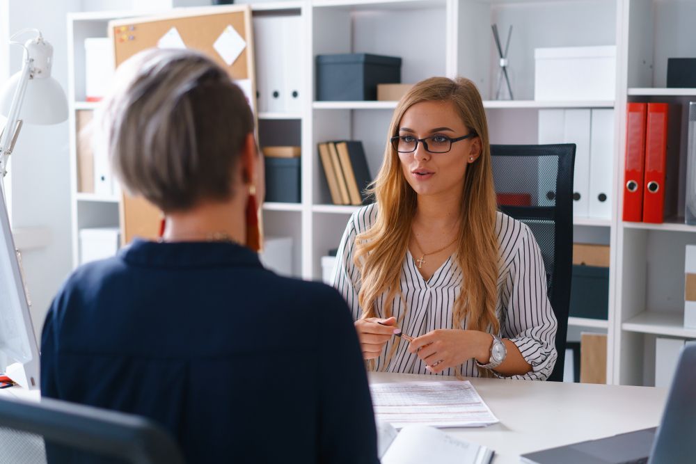 young specialist is iterviewed by manager of big successful business company dream about working here future job concept