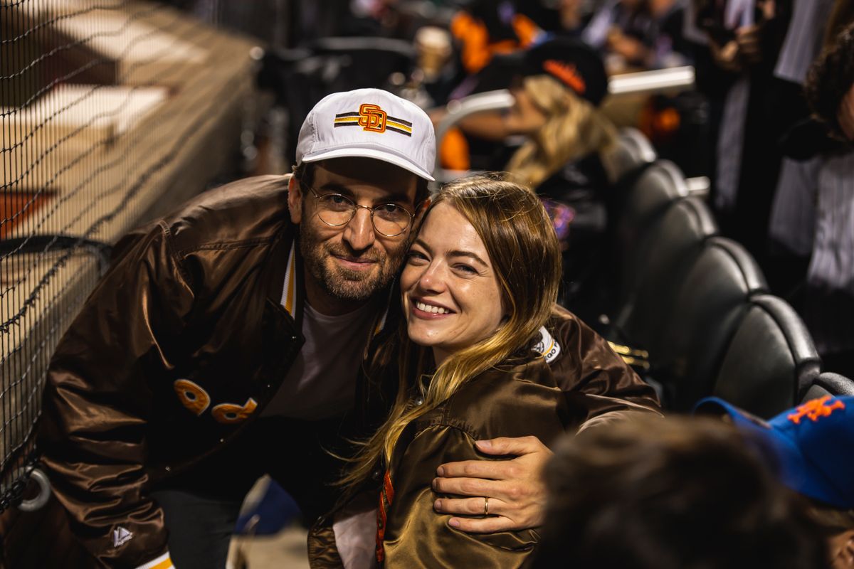 NEW YORK, NY - OCTOBER 7: Actress Emma Stone and her husband Dave McCary pose for photo as the San Diego Padres face against the New York Mets in Game One of the Wild Card Series at Citi Field on October 7, 2022 in New York, NewYork. (Photo by Matt Thomas/San Diego Padres/Getty Images)