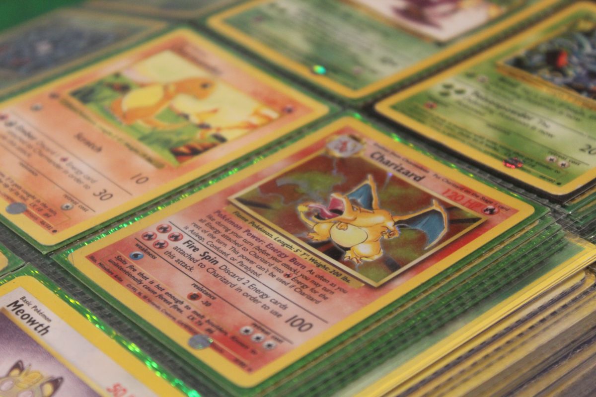 Sarasota, Florida, July 24, 2024: A collection of Rare vintage Pokémon cards, including Charmander, Charizard, Meowth, and Tangela