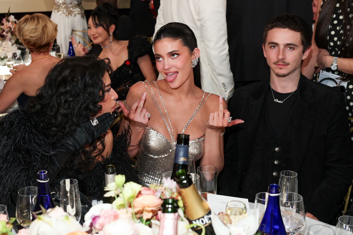 (EDITOR'S NOTE: Image contains profanity.) Odessa A'zion, Kylie Jenner, Timothée Chalamet at the 83rd Annual Golden Globes held at The Beverly Hilton on January 11, 2026 in Beverly Hills, California. (Photo by Christopher Polk/2026GG/Penske Media via Getty Images)