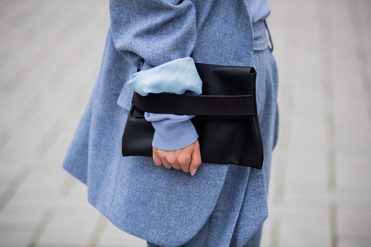 DUSSELDORF, GERMANY - JANUARY 25: Gitta Banko is seen wearing light blue oversized wool blazer & pants, black leather clutch by Boscana x Gitta Banko on January 25, 2020 in Dusseldorf, Germany. (Photo by Christian Vierig/Getty Images)