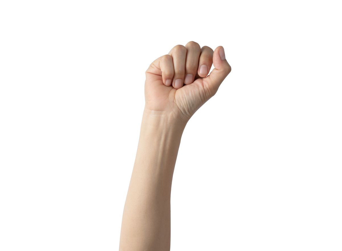 hand clenched something isolated on white background