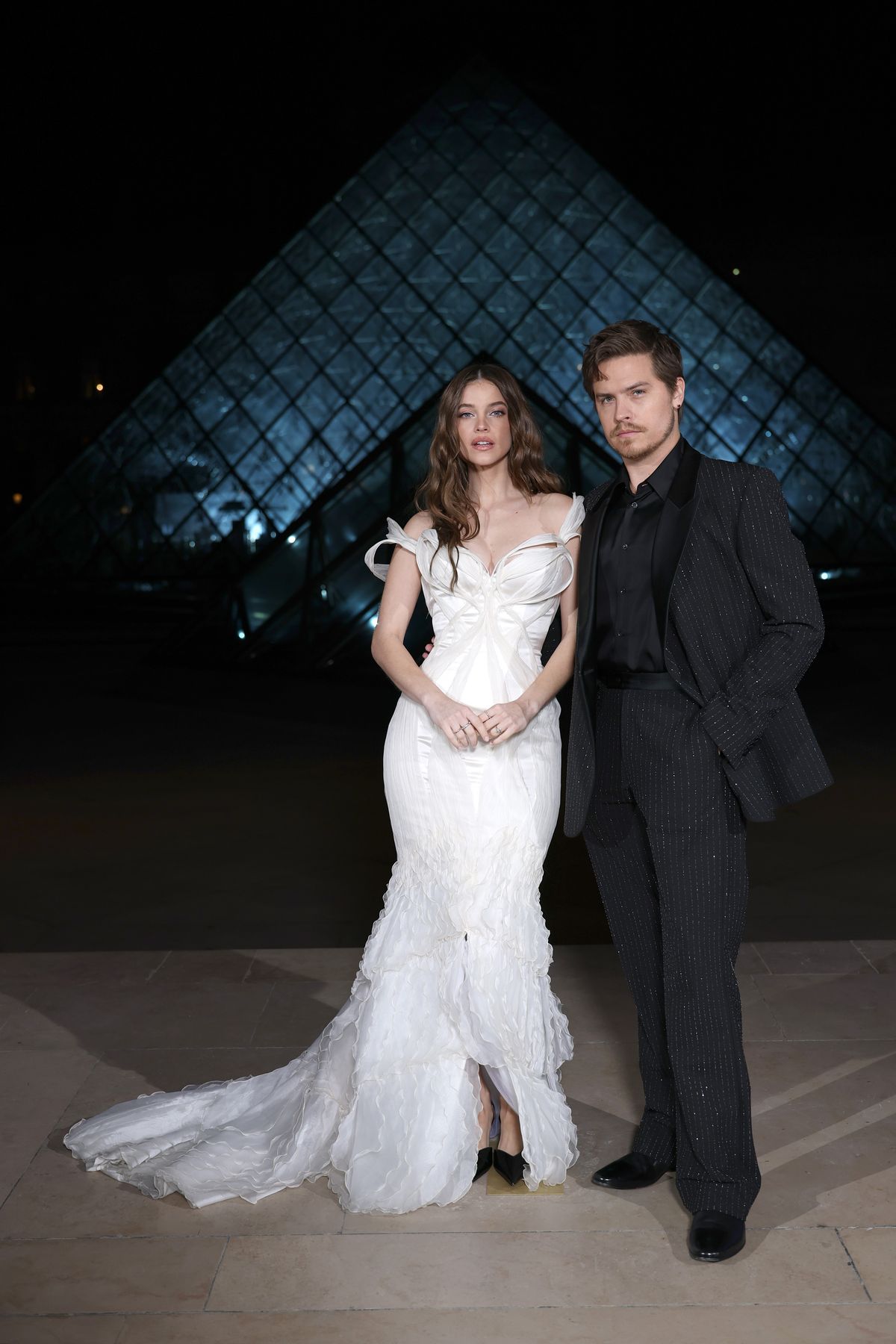 PARIS, FRANCE - MARCH 03: Barbara Sprouse and Dylan Sprouse attend the Grand Dîner du Louvre at Musee du Louvre on March 03, 2026 in Paris, France. The purpose of this annual evening is to raise funds, all of which will go towards measures to safeguard the Museum's heritage. (Photo by Aurore Marechal/Getty Images)