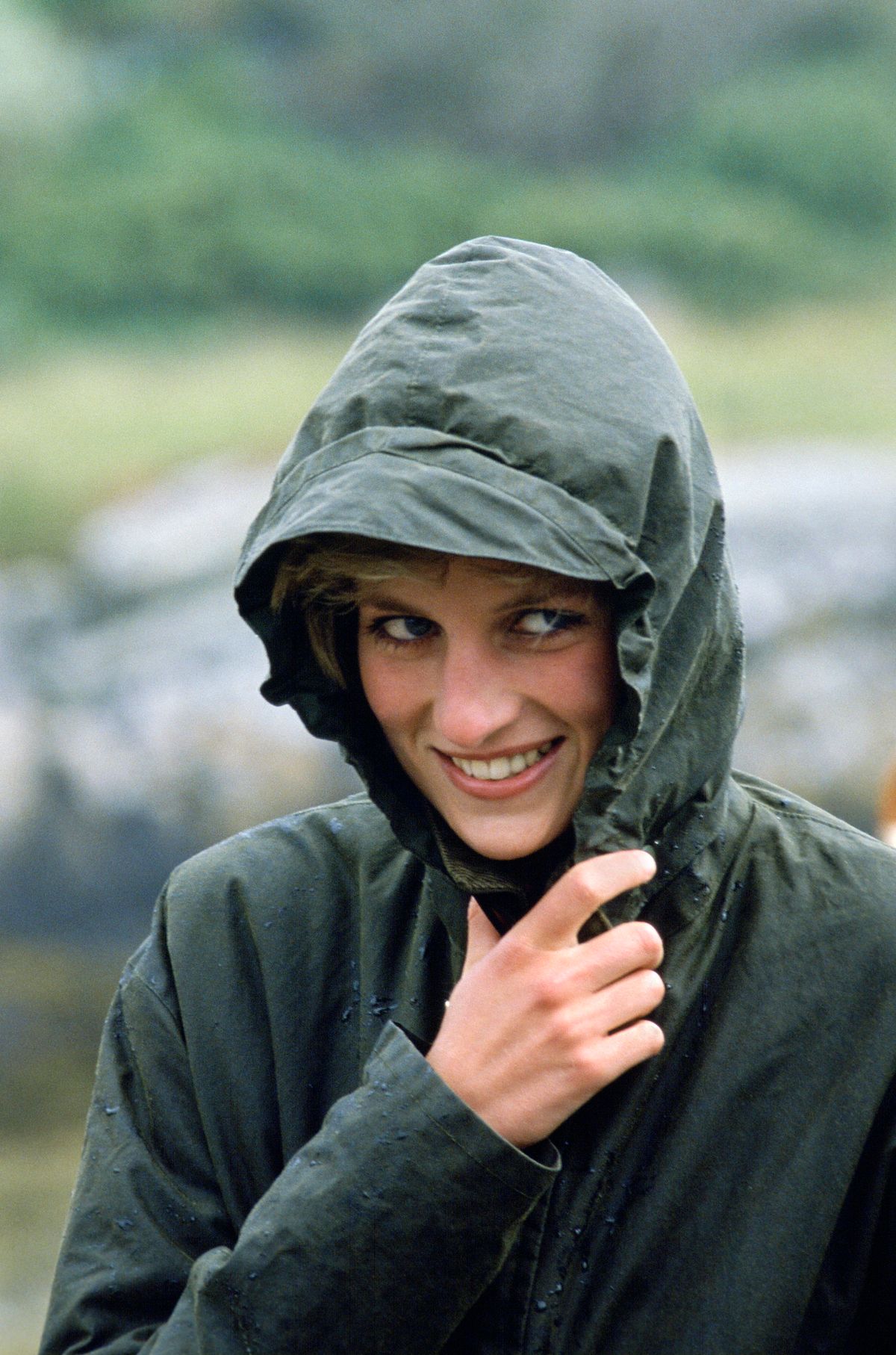 WESTERN ISLES, UNITED KINGDOM - JULY 04: Diana Princess Of Wales Wearing A Waterproof Barbour Style Jacket In The Rain During A Visit To The Western Isles Of Scotland (Photo by Tim Graham Photo Library via Getty Images)