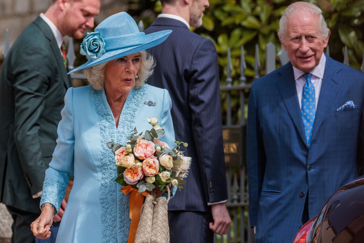 King Charles III and Queen Camilla, holding a posy of flowers presented to her by a young well-wisher, prepare to depart after attending the Easter Sunday church service at St George's Chapel in Windsor Castle on 20th April 2025 in Windsor, United Kingdom. Easter Sunday is the focal point of the Royal Family's Easter celebrations. (photo by Mark Kerrison/In Pictures via Getty Images)