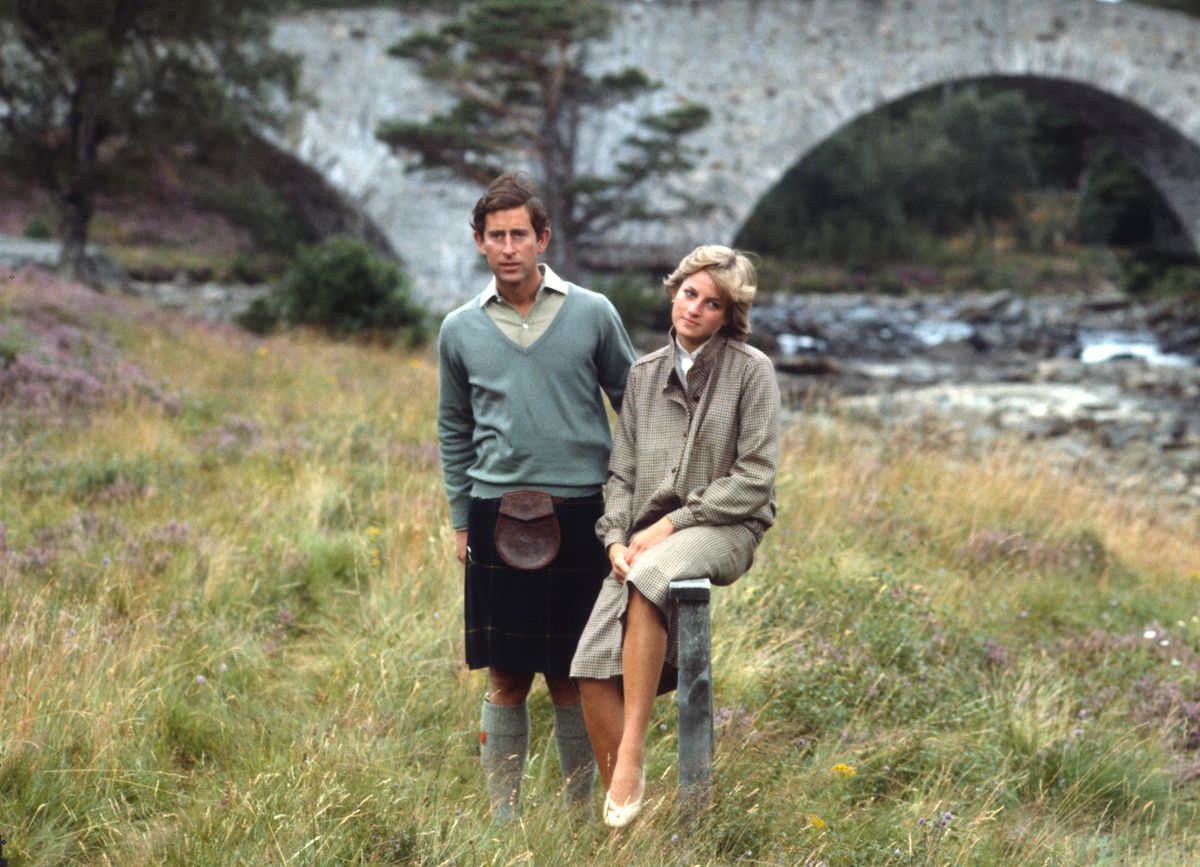 BALMORAL, UNITED KINGDOM - AUGUST 19:  Prince Charles, Prince of Wales and Diana, Princess of Wales, wearing a suit designed by Bill Pashley, pose for a photo on the banks of the river Dee in the grounds of Balmoral Castle during their honeymoon on August 19, 1981 in Balmoral, Scotland. (Photo by Anwar Hussein/Getty Images)