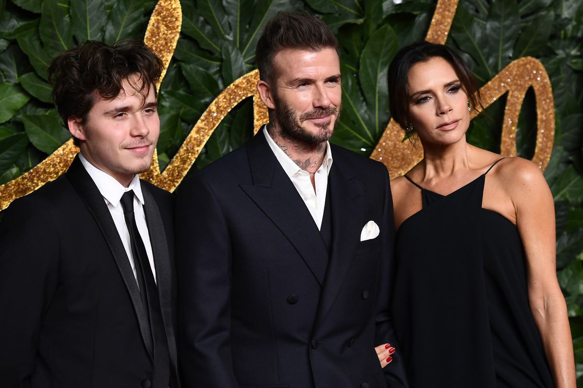 LONDON, ENGLAND - DECEMBER 10:  Brooklyn Beckham, David Beckham and Victoria Beckham arrive at The Fashion Awards 2018 In Partnership With Swarovski at Royal Albert Hall on December 10, 2018 in London, England.  (Photo by Jeff Spicer/BFC/Getty Images for BFC)
