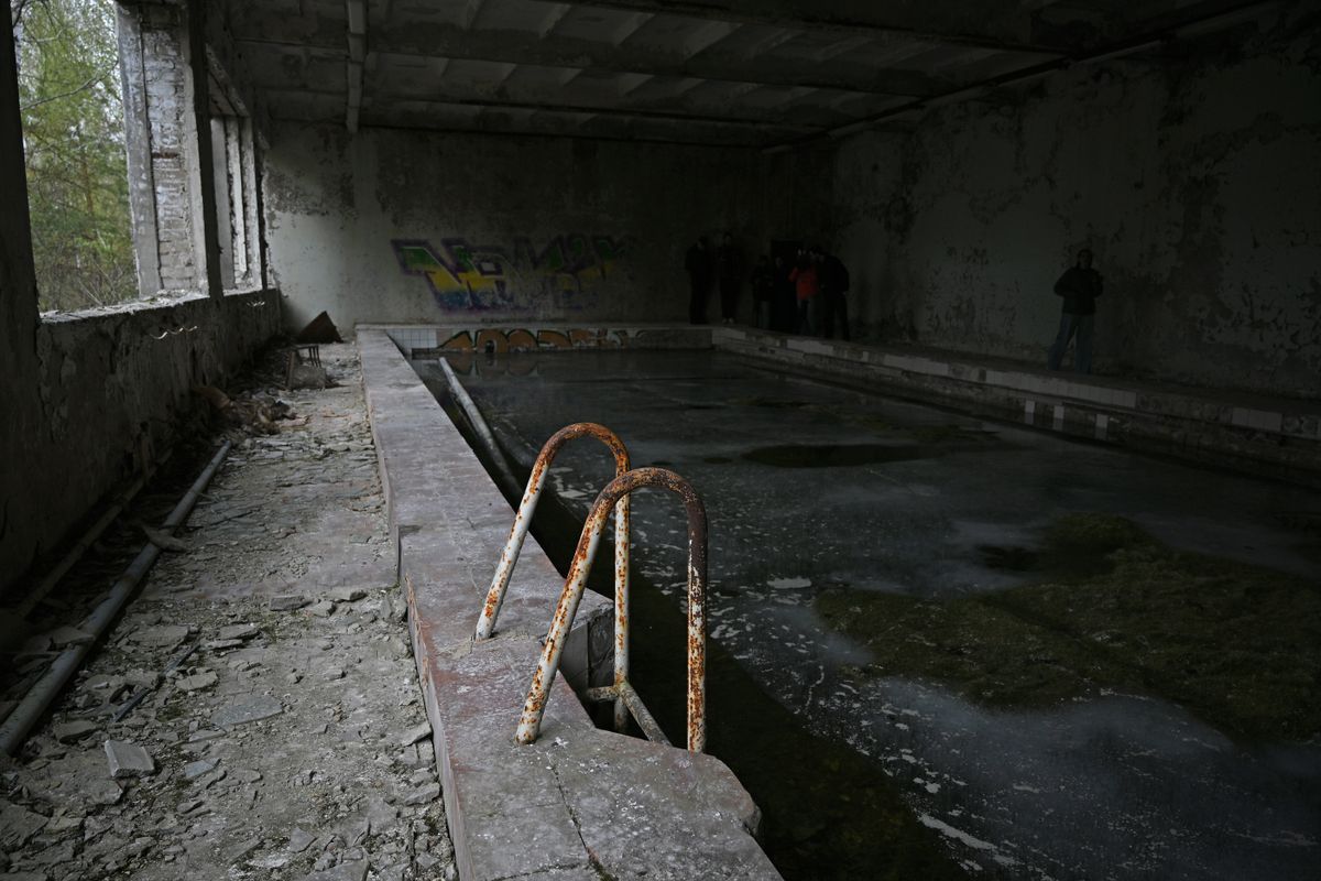 A children's swimming pool is seen in the Energetik Palace of Culture in the ghost town of Prypiat, radioactively contaminated by the Chornobyl disaster, in the Kyiv region, Ukraine, on April 23, 2026. Prypiat, located two kilometers from the nuclear power plant, was evacuated on April 27, 1986, following the explosion of the fourth reactor at the Chornobyl Nuclear Power Plant. April 26, 2026, marks the 40th anniversary of the disaster, one of the worst man-made catastrophes in the history of nuclear power. (Photo by Yevhen Kotenko/Ukrinform/NurPhoto via Getty Images)