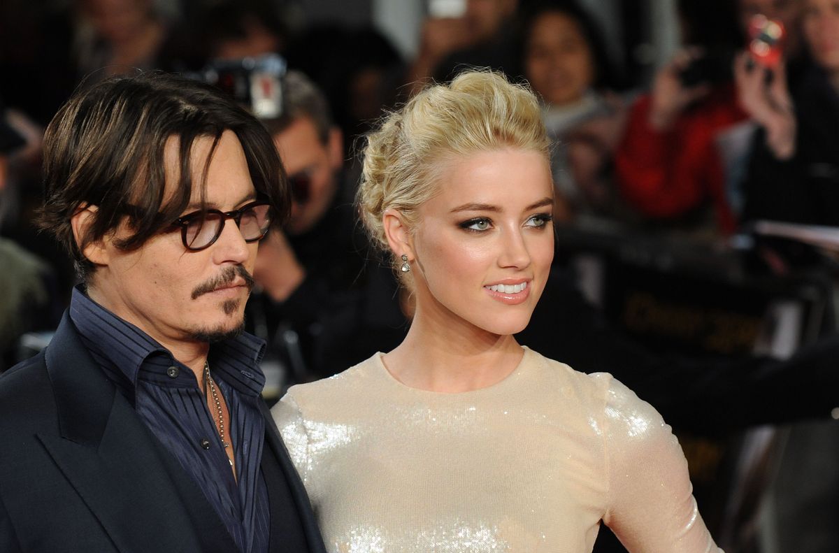 LONDON, UNITED KINGDOM - NOVEMBER 03: Johnny Depp and Amber Heard attend The UK Premiere of 'The Rum Diary' at  on November 3, 2011 in London, England. (Photo by Stuart Wilson/Getty Images)