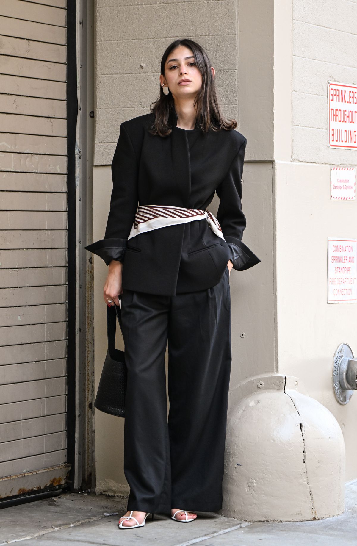 NEW YORK, NEW YORK - SEPTEMBER 11: Katrina Santiago is seen wearing a black blazer, black pants, black bag and white heels outside the Lafayette 148 presentation on September 11, 2025 in New York City. (Photo by Daniel Zuchnik/Getty Images)