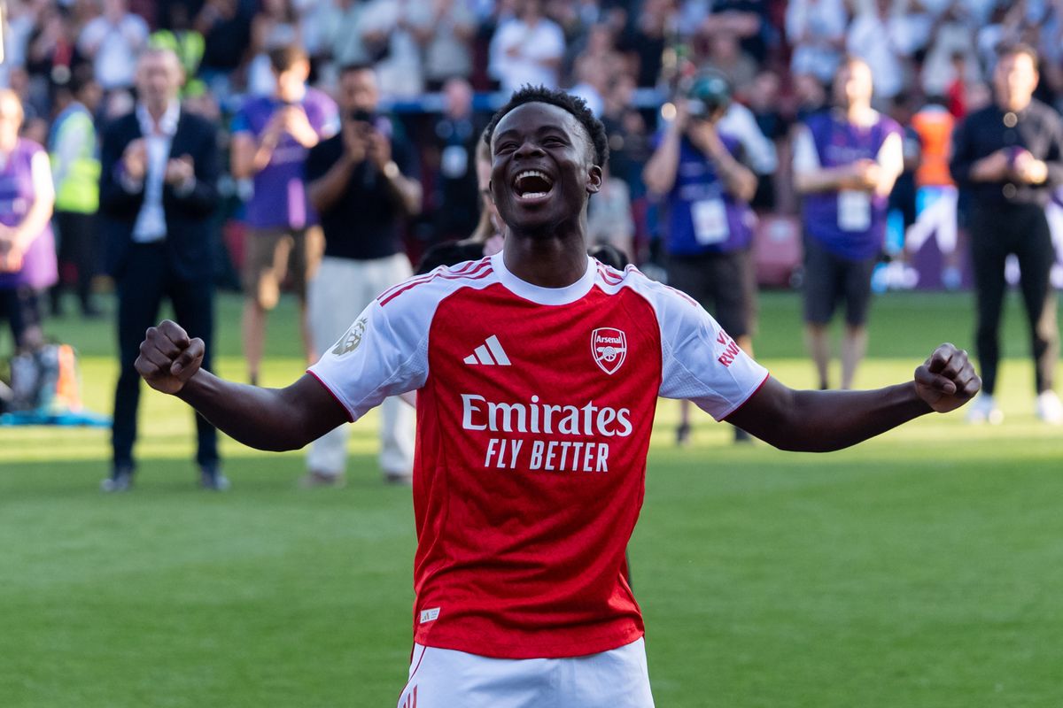 LONDON, ENGLAND - MAY 24:  Bukayo Saka #7 of Arsenal celebrates walking to the trophy at the Premier League match between Crystal Palace and Arsenal at Selhurst Park on May 24, 2026 in London, England. (Photo by MB Media/Getty Images)