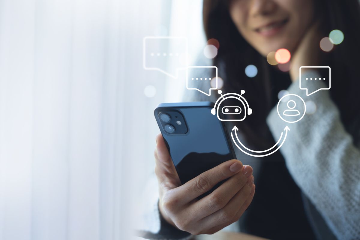 Digital AI chatbot coversation assistant, artificial intelligence technology, Happy young Asian woman using mobile smartphone with AI chatbot for online information, internet bot automatic answering
