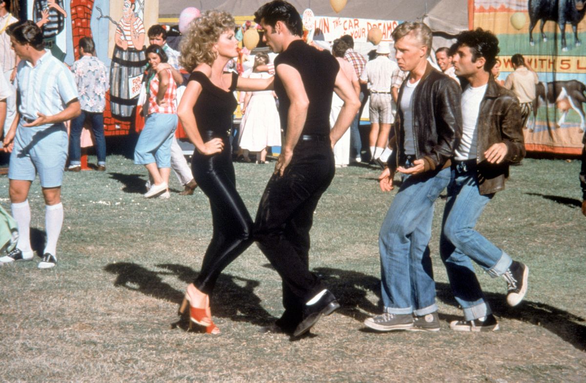 Olivia Newton-John and John Travolta on the set of Grease, directed by Randal Kleiser, 1978. (Photo by Paramount Pictures/Sunset Boulevard/Corbis via Getty Images)