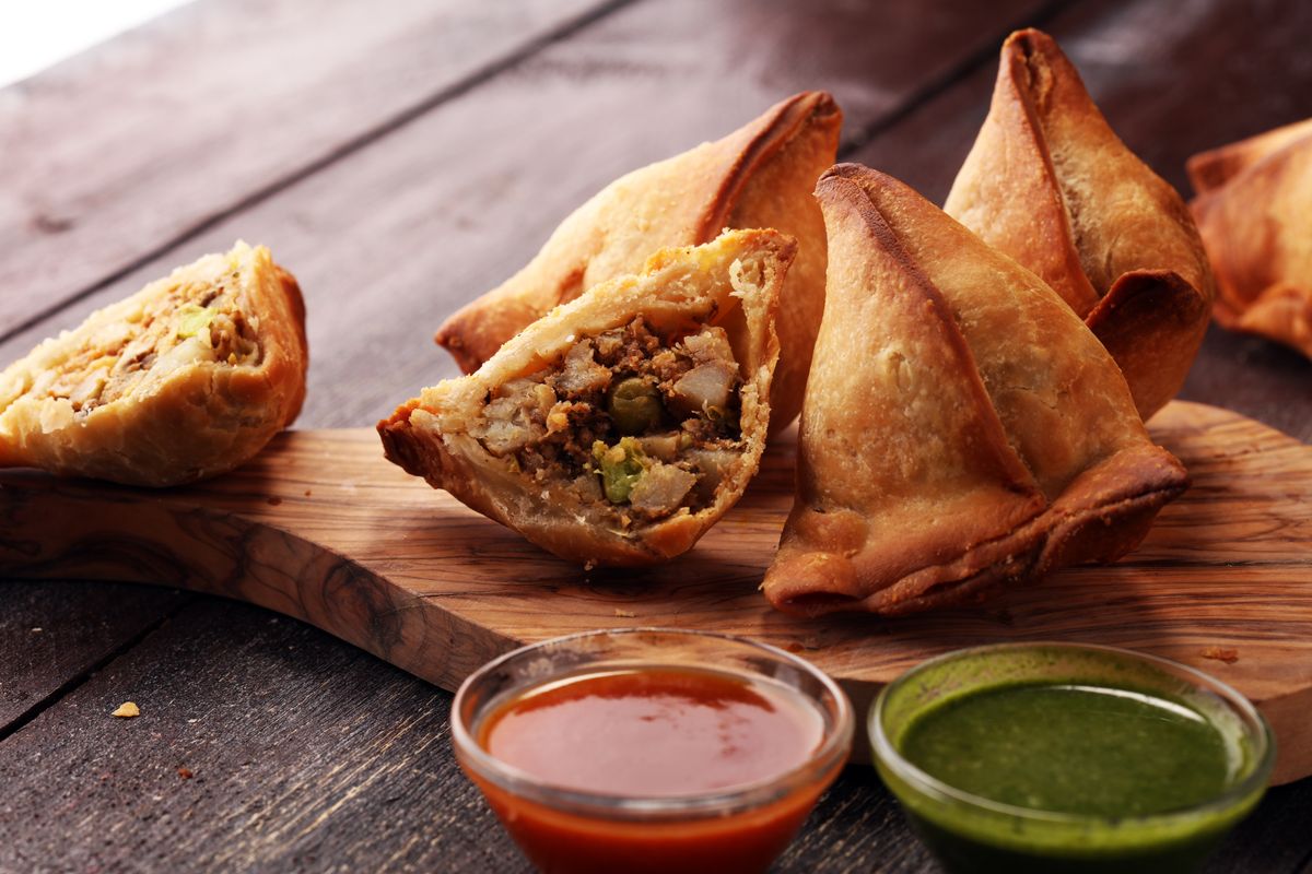 Vegetarian samsa or samosas.Indian special traditional street food punjabi samosa or Coxinha, Croquete and other Fried Brazilian Snacks.