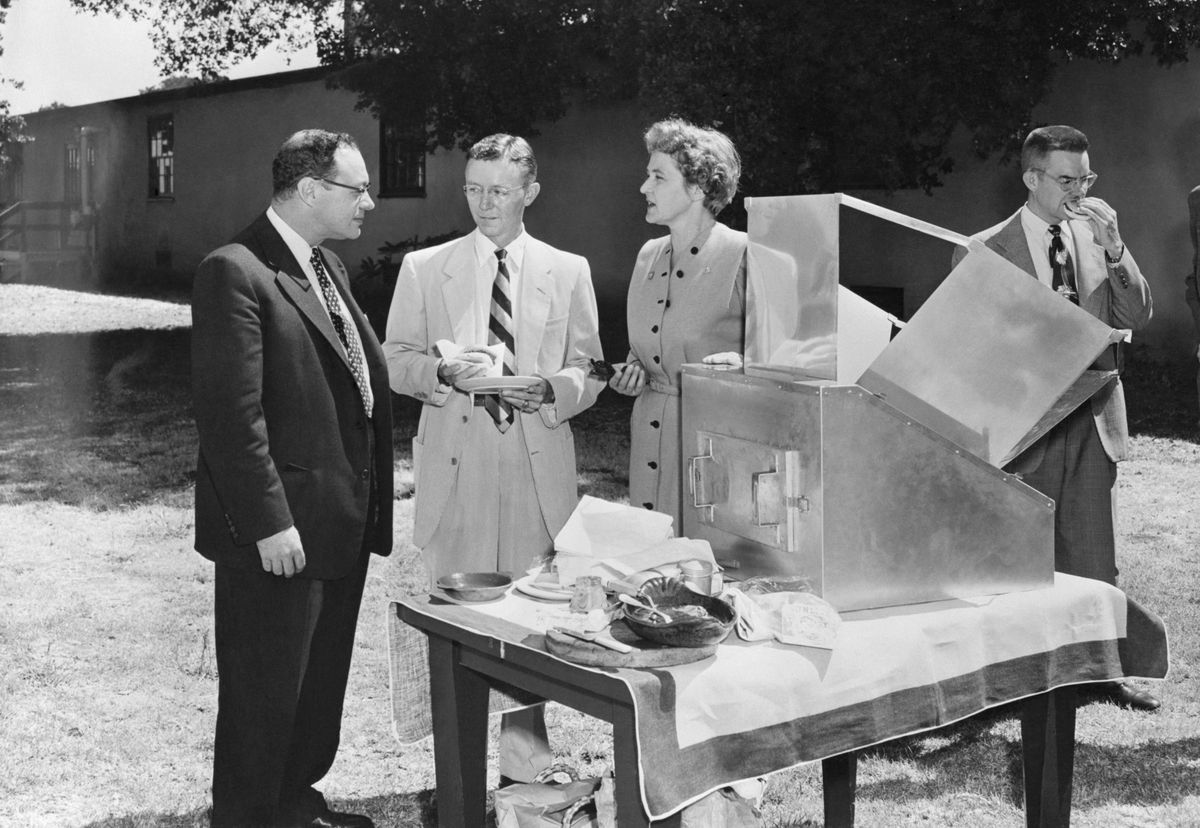 Dr. Maria Telkes, "world's most famous woman inventor in solar energy," speaks with Dr. J.E. Hobson (left) and Thomas K. Hitch.