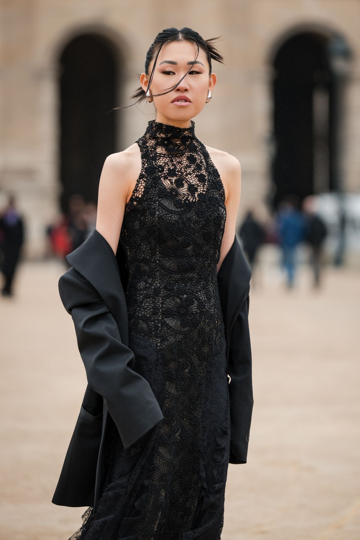 PARIS, FRANCE - FEBRUARY 29: Jaime Xie is seen, wearing a black oversized Off White blazer jacket and a black turtleneck mesh floral embroidery long pleated dress, outside Off-White during the Womenswear Fall/Winter 2024/2025 as part of Paris Fashion Week on February 29, 2024 in Paris, France. (Photo by Claudio Lavenia/Getty Images)