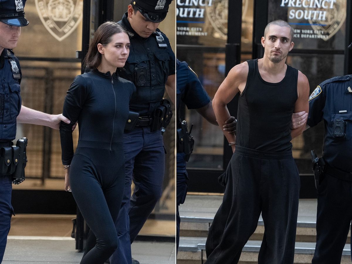 Angela Nikolau, left, and Ivan Beerkus are pictured in police custody leaving the New York Police Department's Midtown South Precinct station house on Wednesday, July 1, 2026 in Manhattan, New York.,Image: 1113863430, License: Rights-managed, Restrictions: , Model Release: no