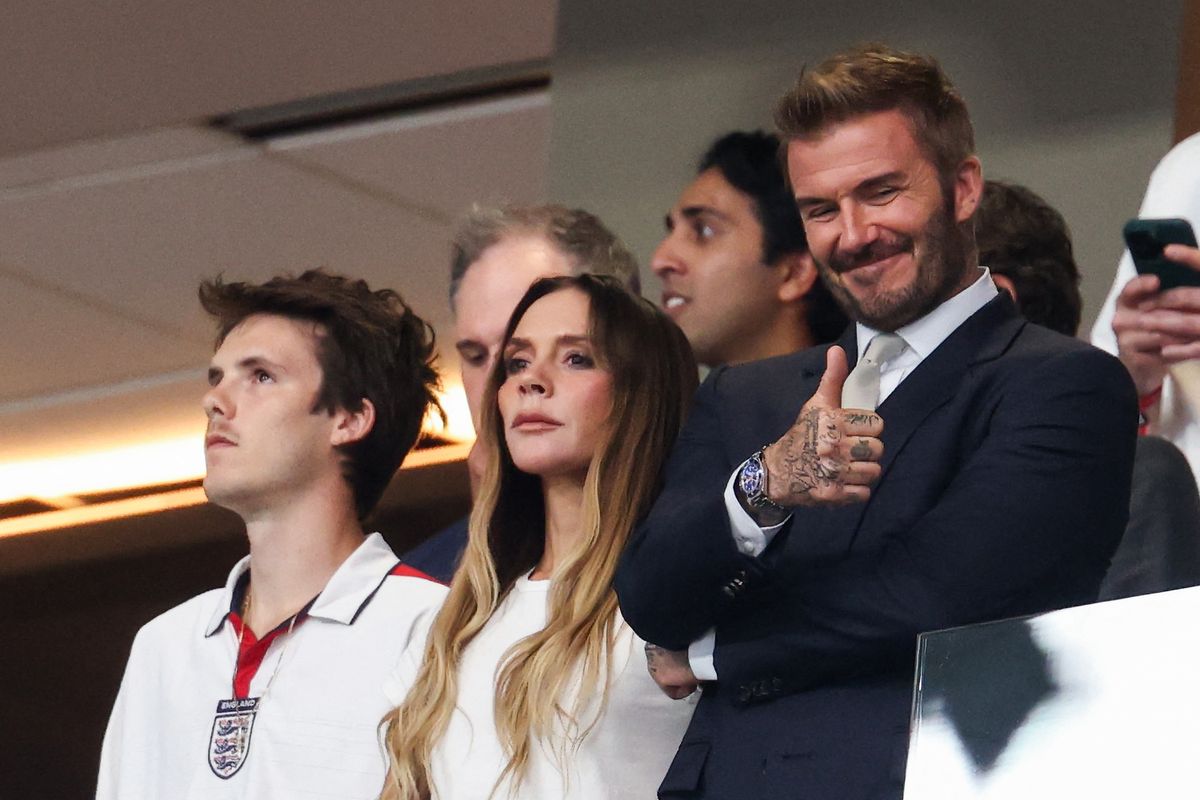 English former football player David Beckham (R), singer and fashion designer Victoria Beckham (C), and their son Cruz Beckham (L) attend the 2026 World Cup football tournament semi-final match between England and Argentina at the Atlanta Stadium in Atlanta on July 15, 2026. (Photo by Odd ANDERSEN / AFP)