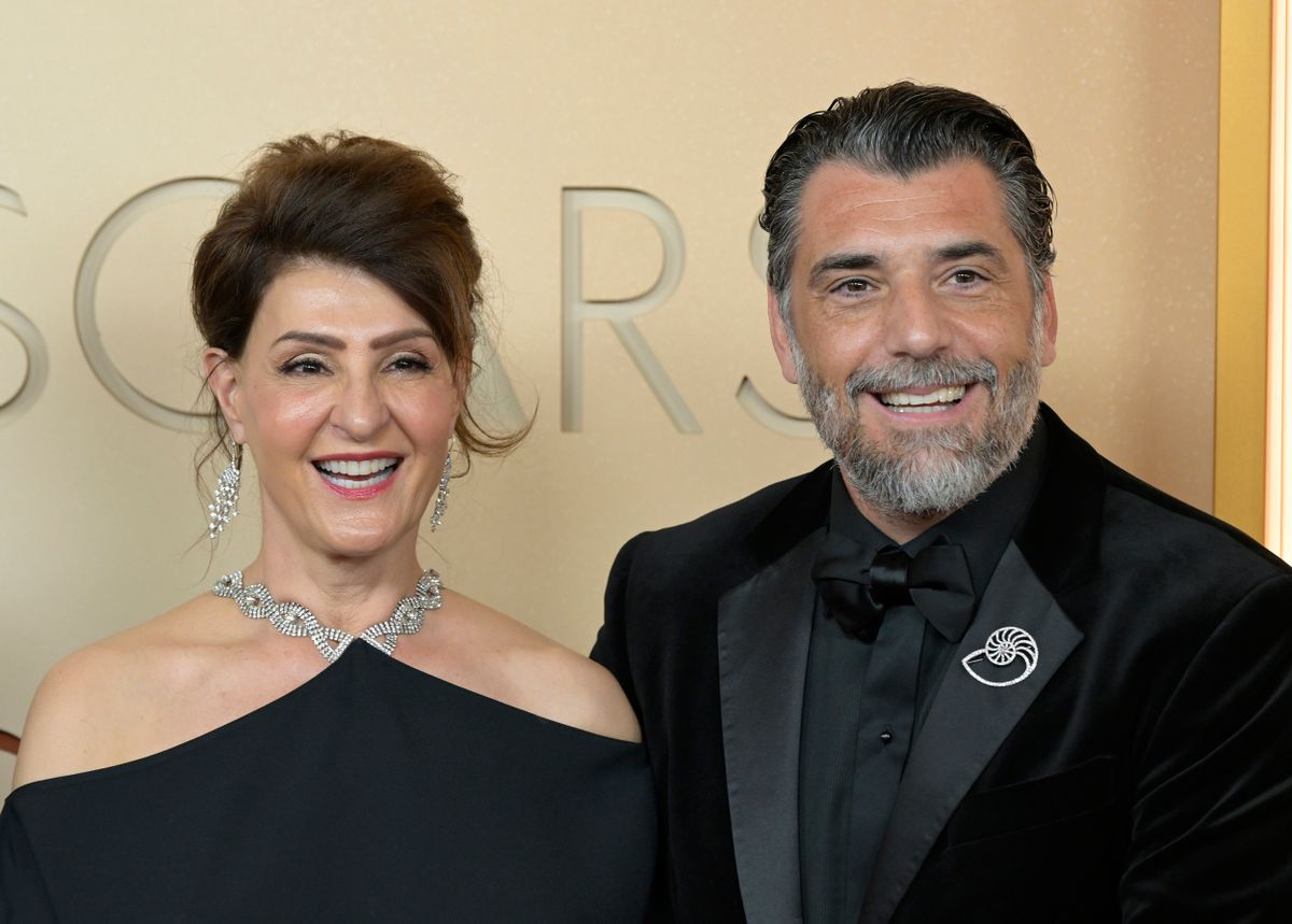 HOLLYWOOD, CA - MARCH 15: Nia Vardalos, Spiros Katsagans at the 98th Oscars at Dolby Theatre on March 15, 2026 in Hollywood, California. Credit: Marty/MediaPunch