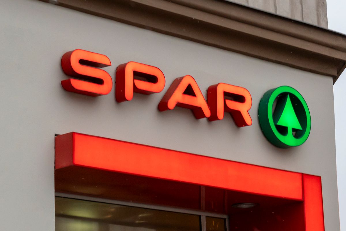 Vienna, Austria- Feb 21, 2026: SPAR sign displayed prominently on a retail store. The bold letters and distinct logo signify convenience and quality shopping experience.