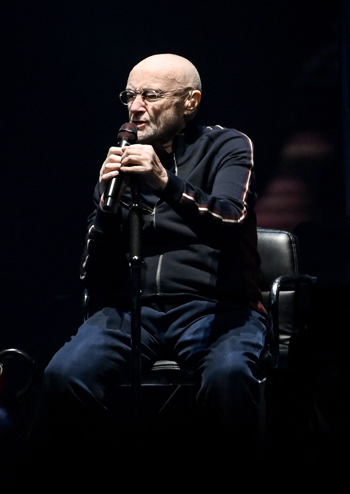 07 March 2022, Berlin: Musician Phil Collins of the band Genesis sits on stage at the Mercedes-Benz Arena. Photo: Britta Pedersen/dpa-Zentralbild/dpa Genesis  The Last Domino  tour in Berlin, Germany March   2022