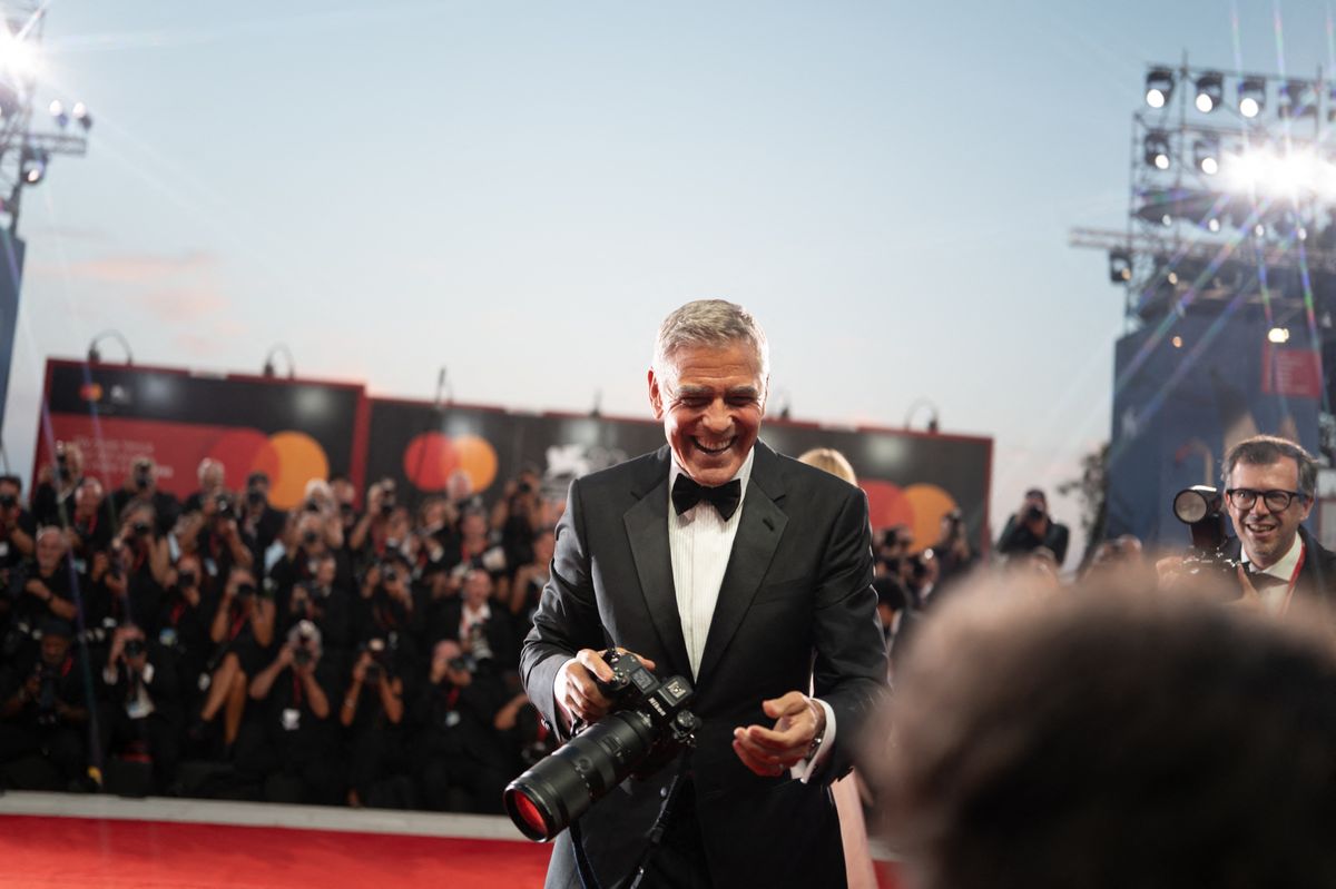 George Clooney poses with Laura Dern after receiving the Golden Lion for Lifetime Achievement Award during the opening ceremony of the 83rd Venice International Film Festival at Sala Grande in Venice, Italy, on September 2, 2026. (Photo by Luca Carlino/NurPhoto) (Photo by Luca Carlino / NurPhoto via AFP)